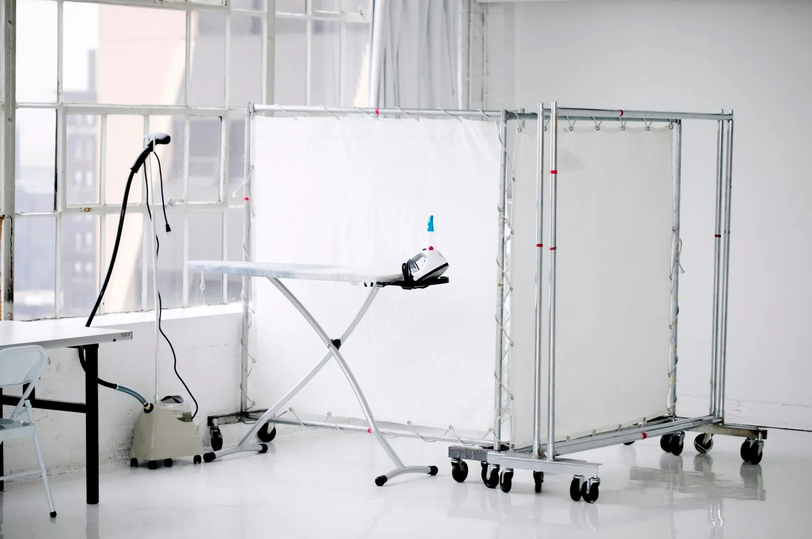 Concealing a Garment Rack Within a Bedroom Space