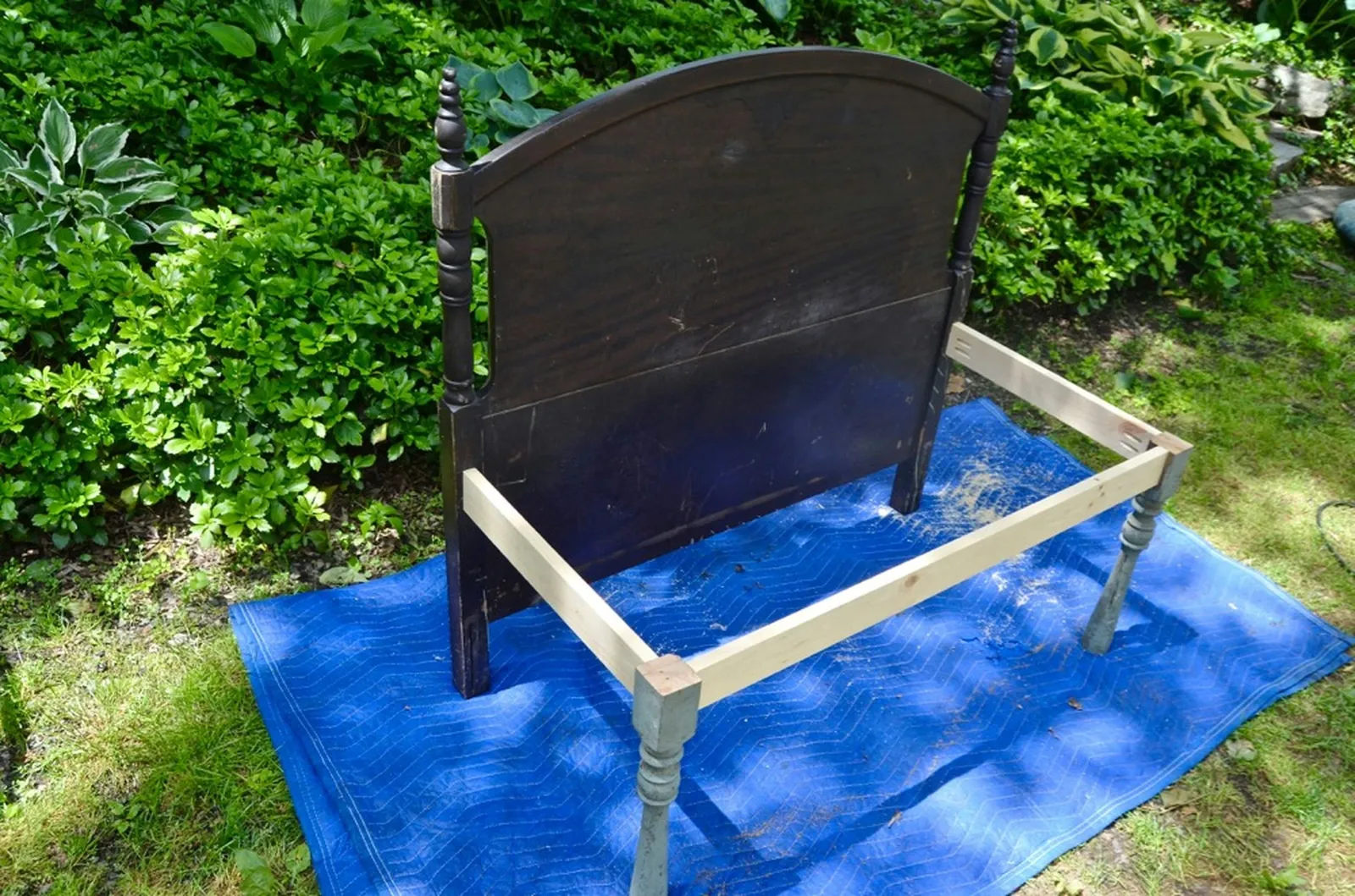 legs and support beams attached to headboard
