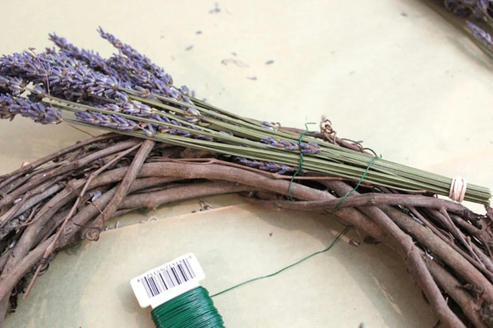 Wrap the first lavender bunch around the wreath.