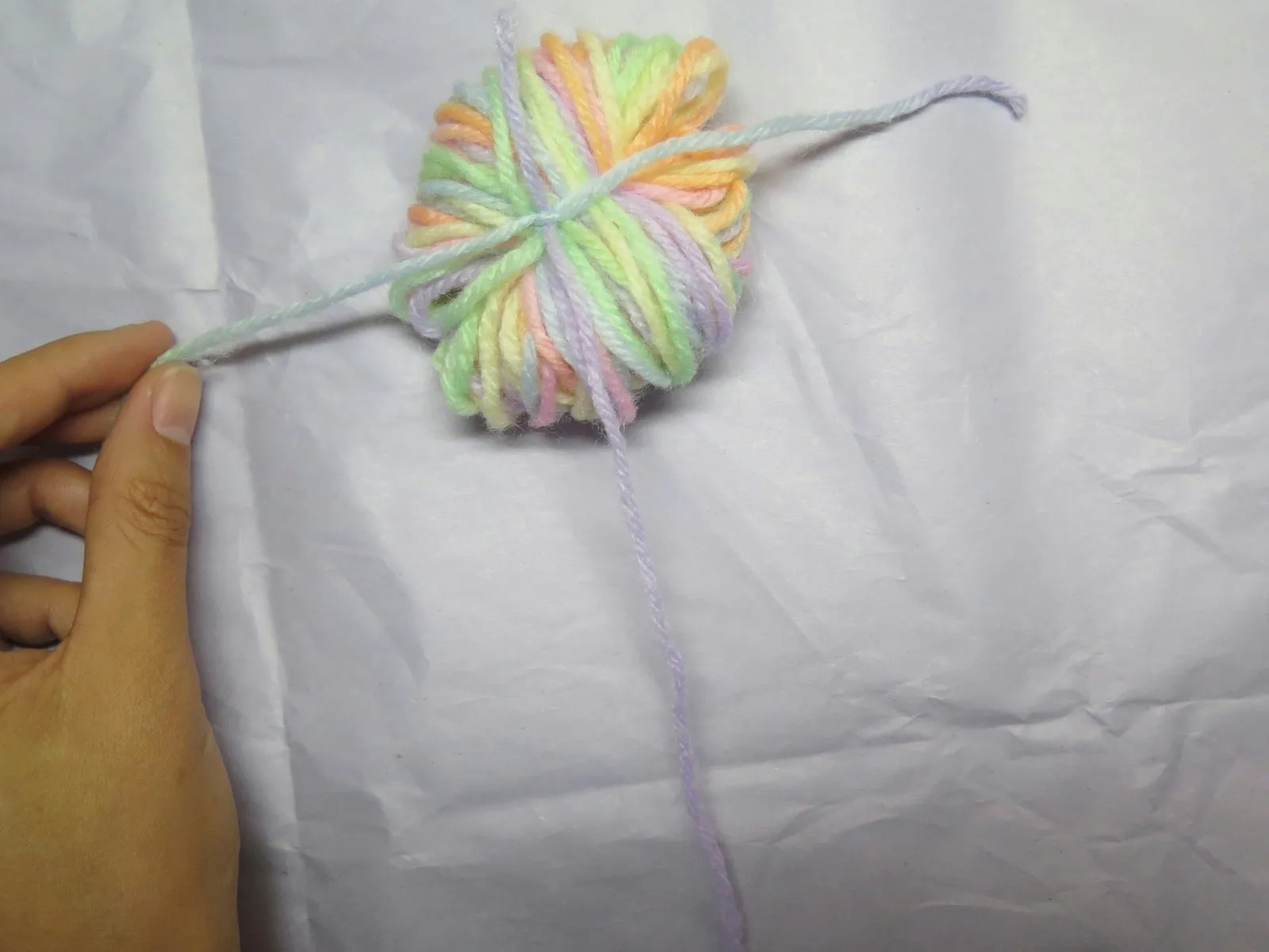 Adding a tail to a bundle of yarn