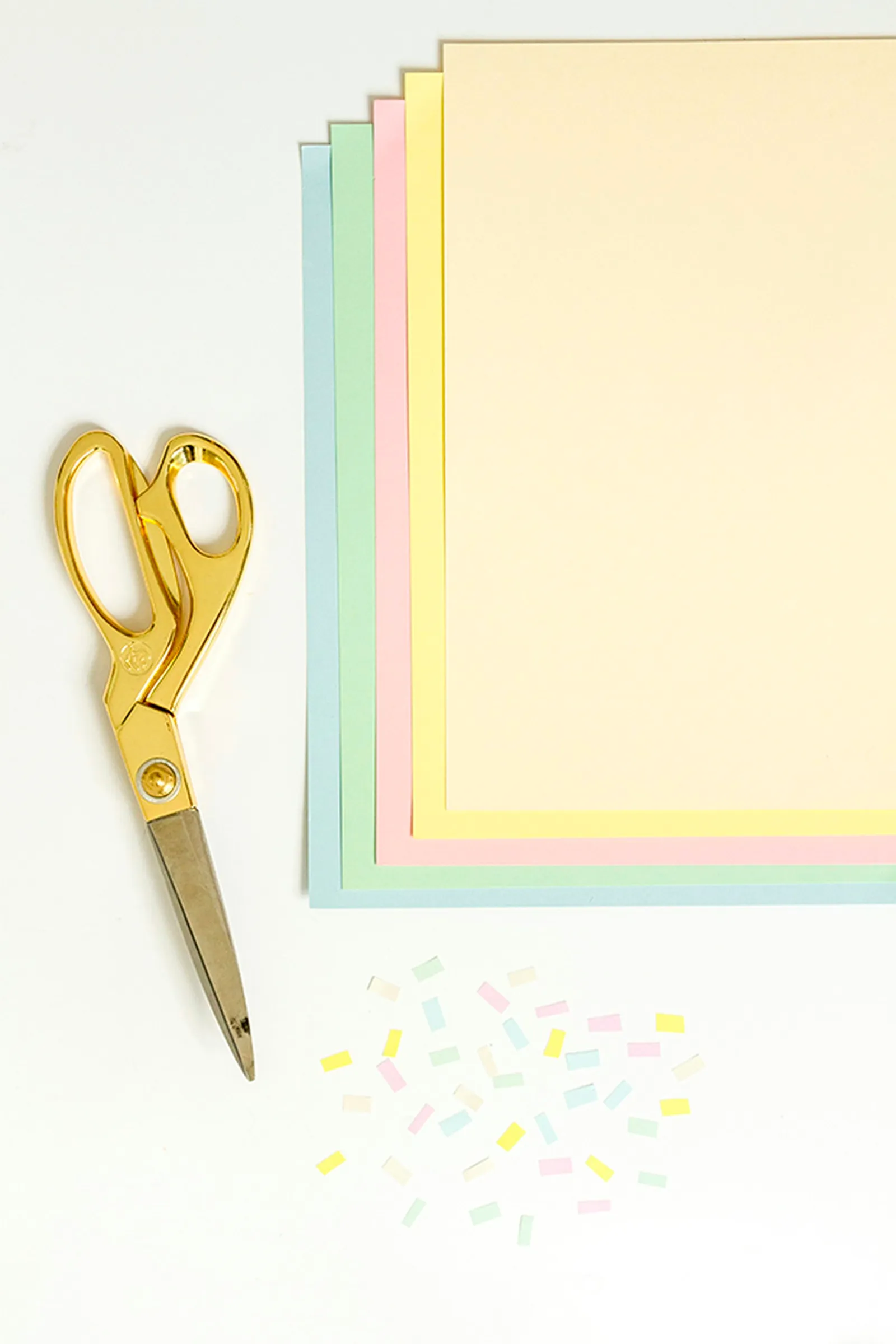 Cut colorful cardstock paper to look like sprinkles, and glue it on the cotton balls.