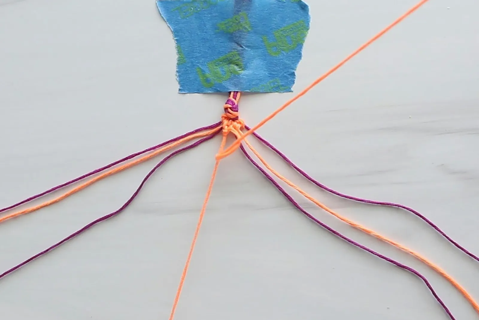 Knotting embroidery thread for a heart friendship bracelet