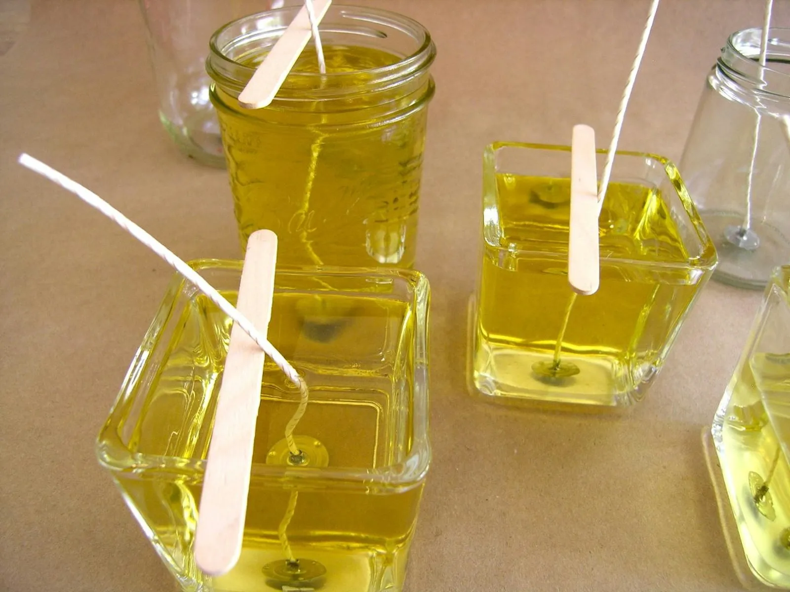 Pour wax into containers.