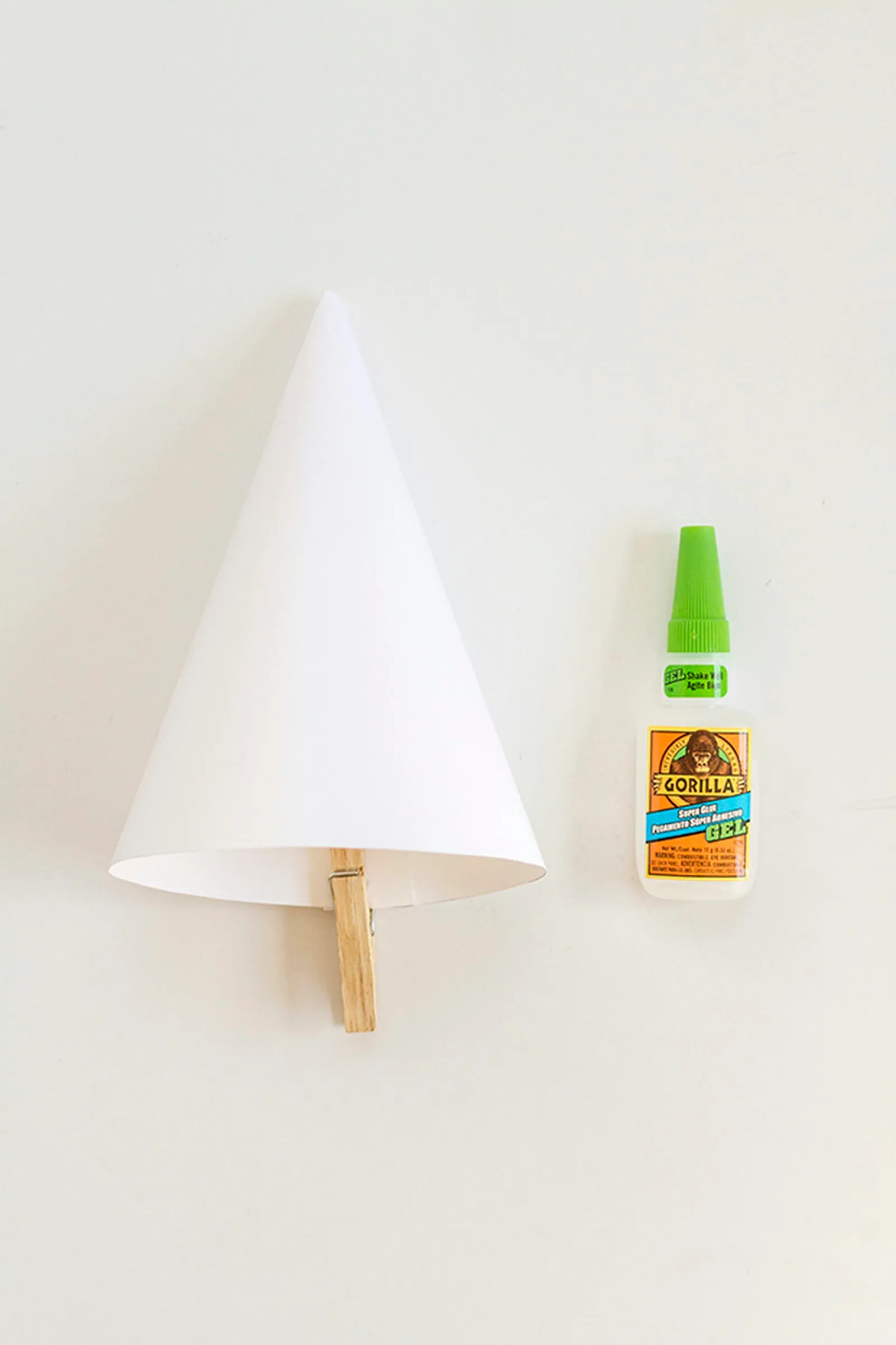 Use glue to finish the cone shape.