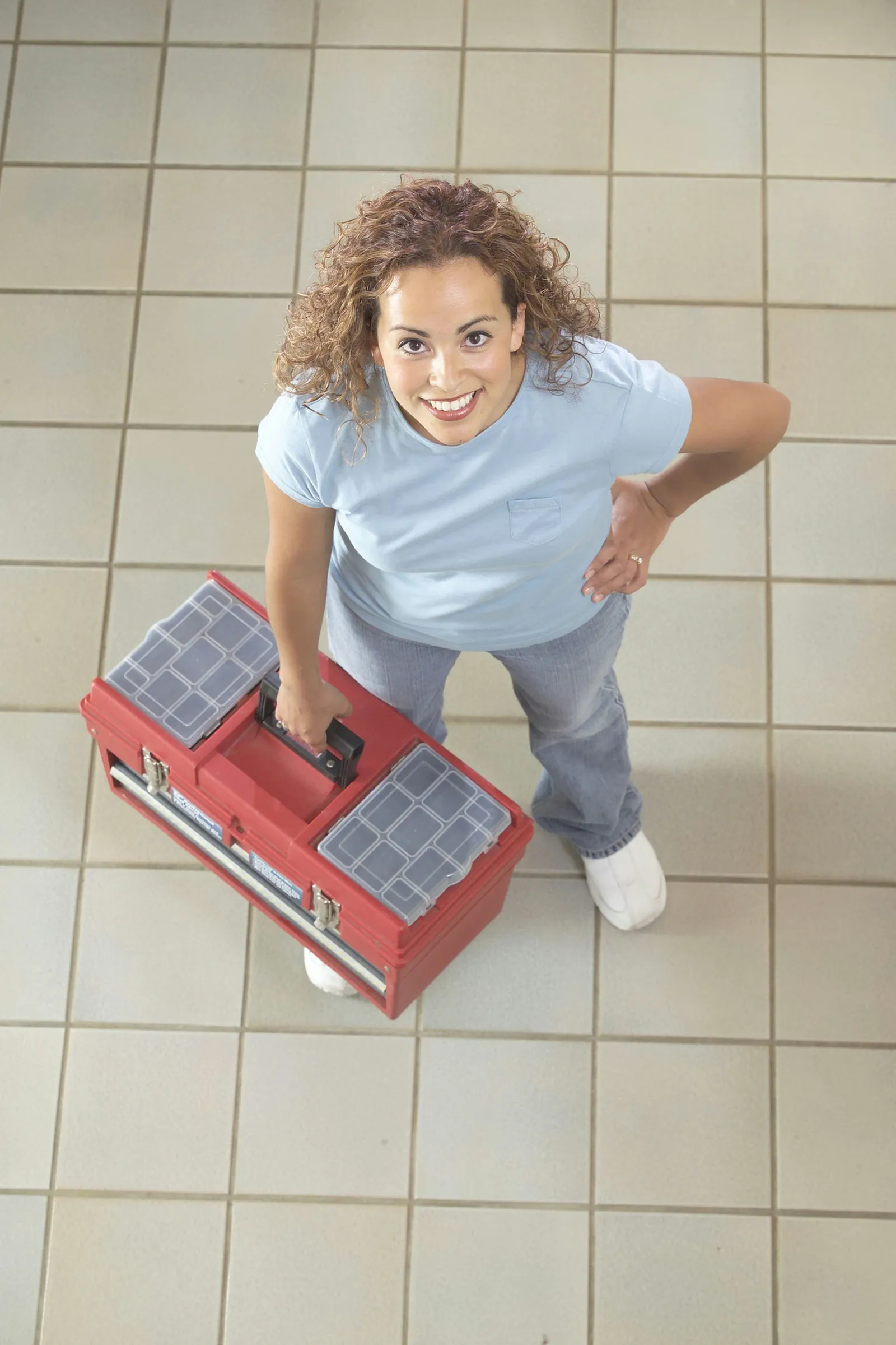 Laying Self-Adhesive Vinyl Tiles Over a Concrete Slab