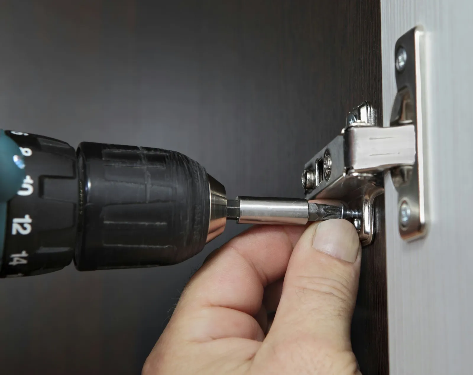 Cordless drill with fastener bit close-up.