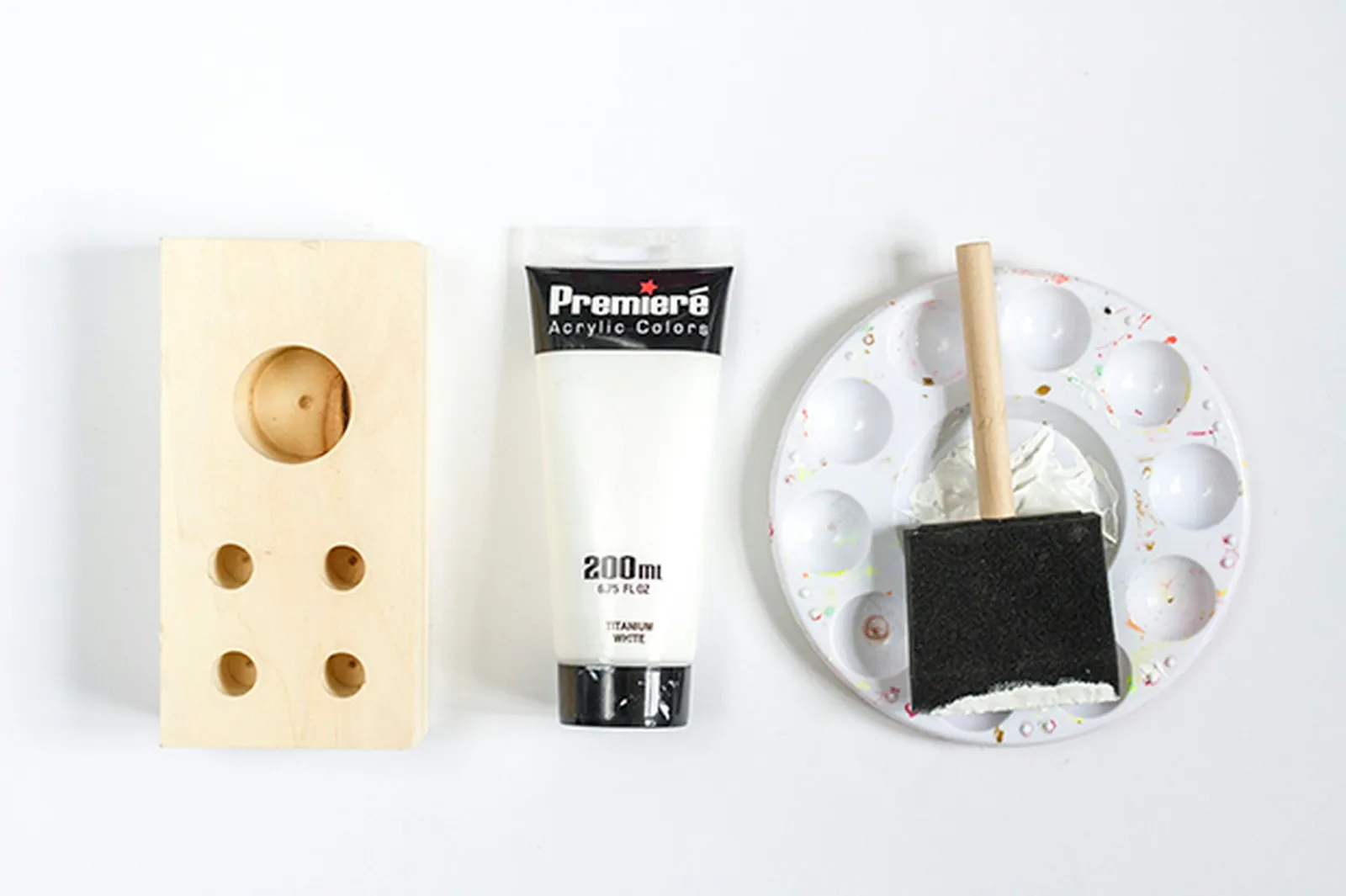 Acrylic white paint gives the wood block an even color and finish.