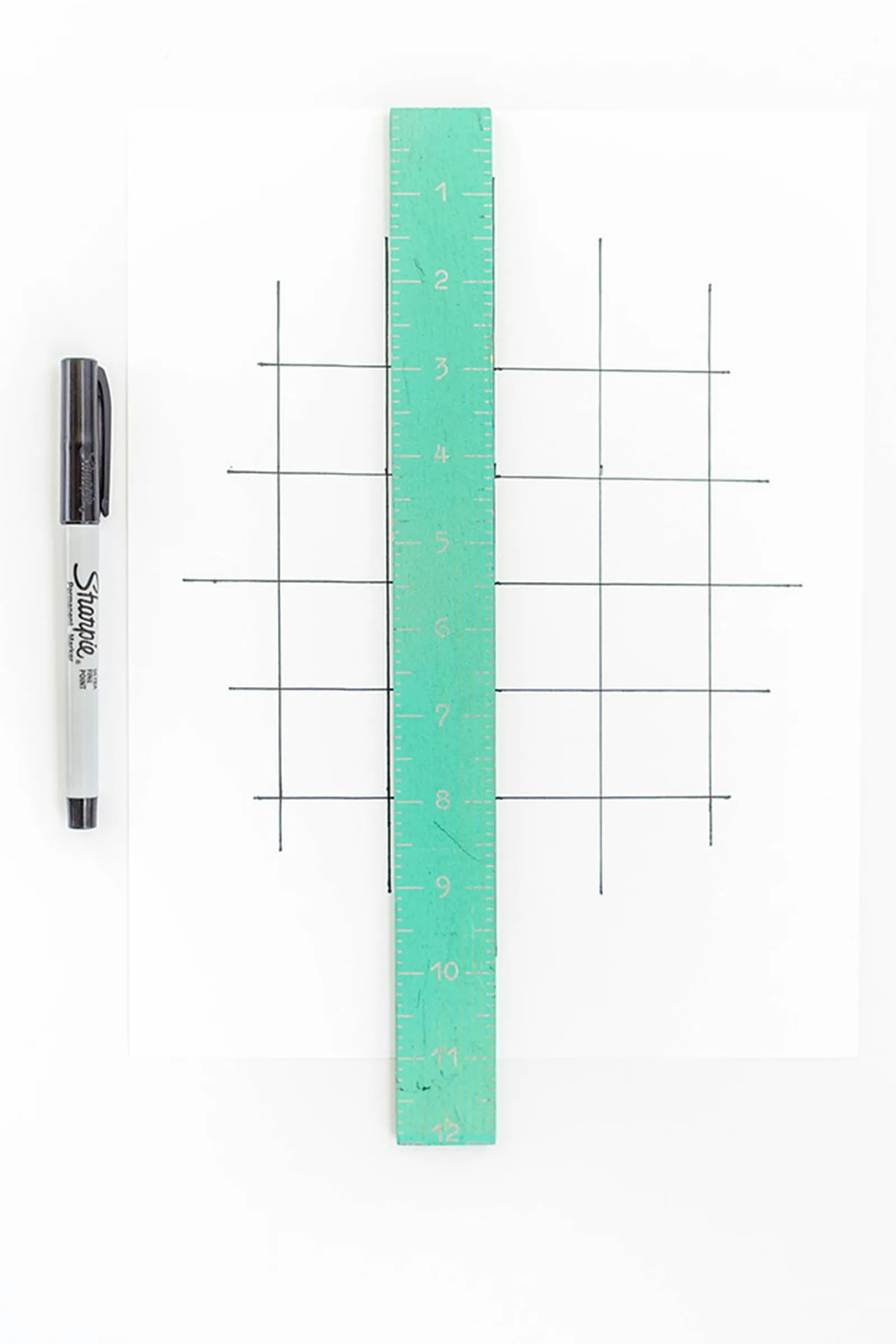 Draw a gridded diagram on a piece of thick white card stock.
