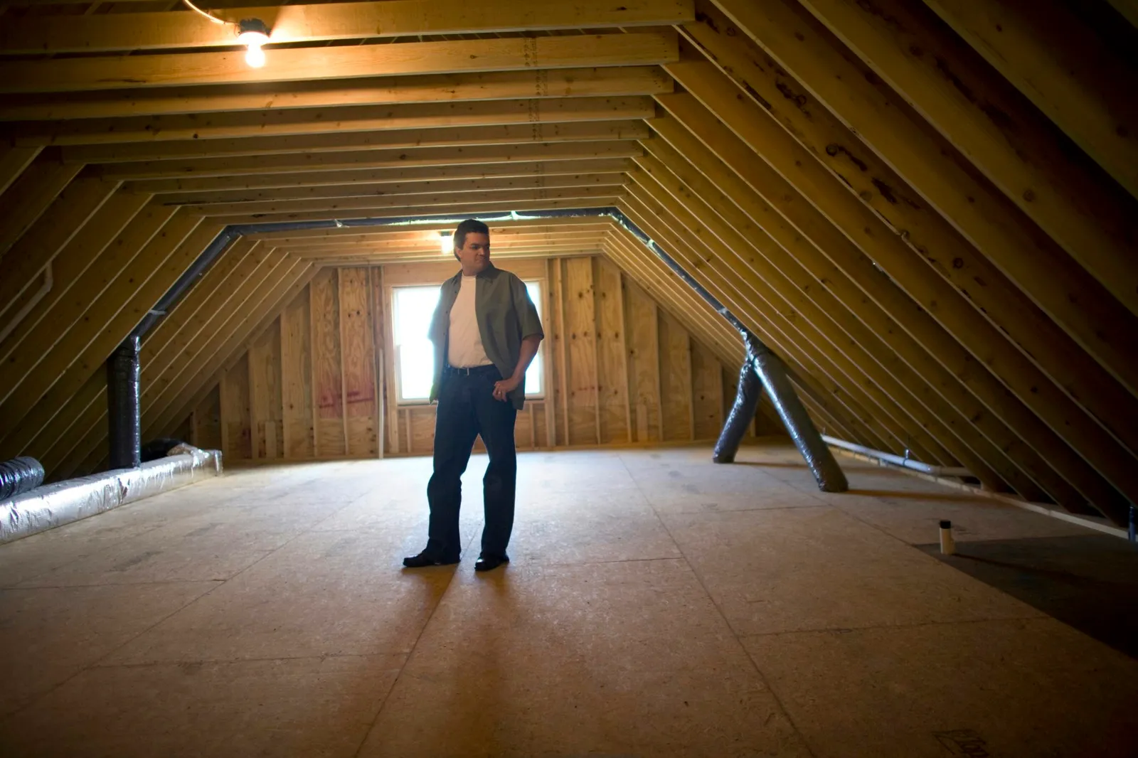 Man in empty attic
